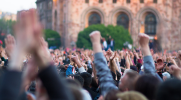 Crowd gathered during a large public demonstration.