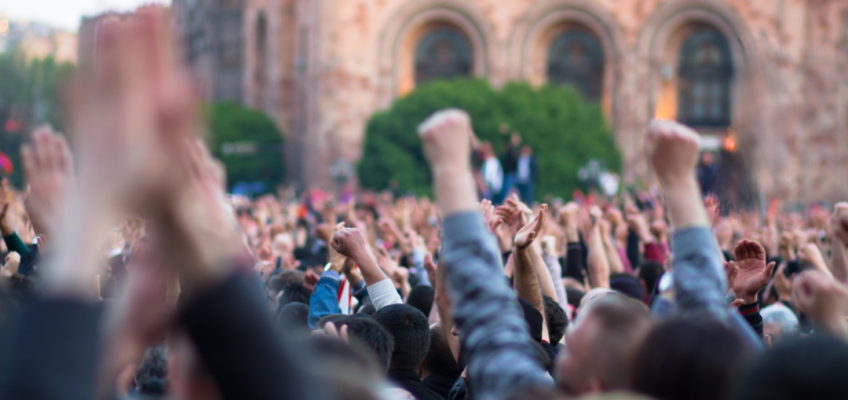 Crowd gathered during a large public demonstration.
